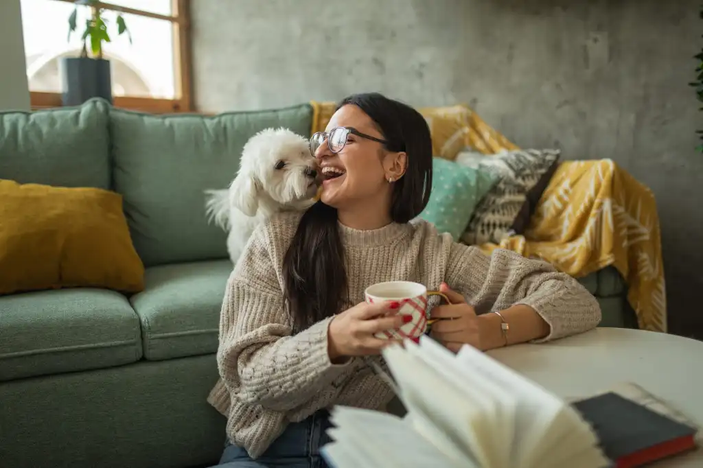 Happy dog owner in apartment