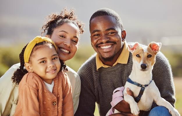 Happy family with their quiet hypoallergenic dog